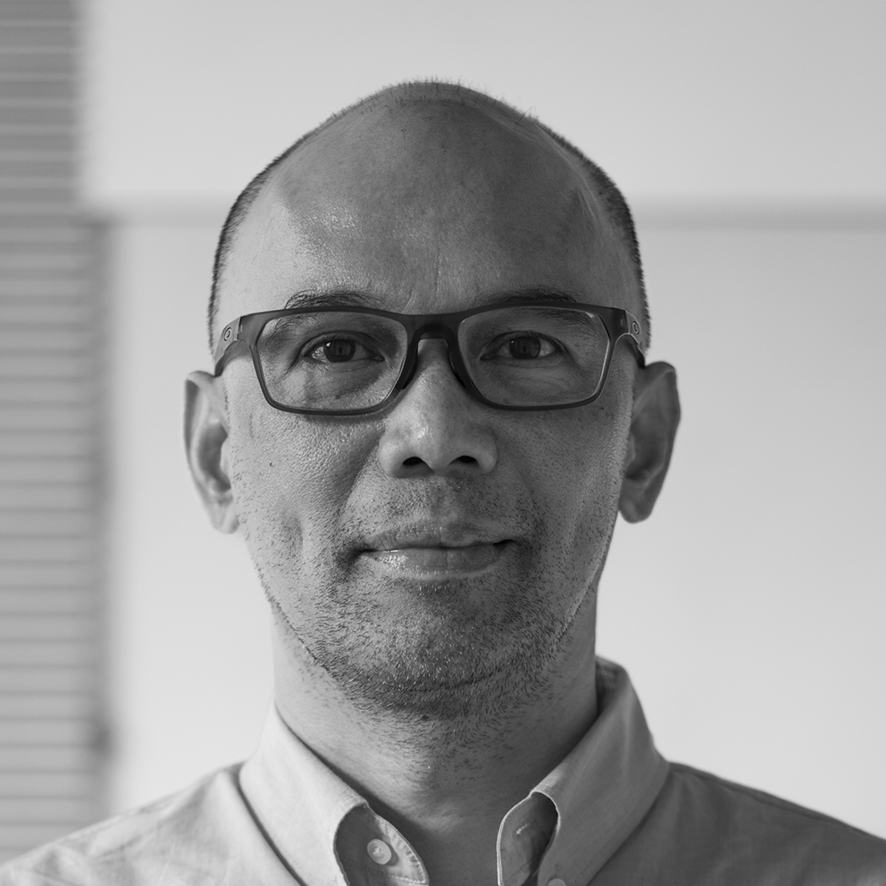 Black and white photo of Dino Delotavo.