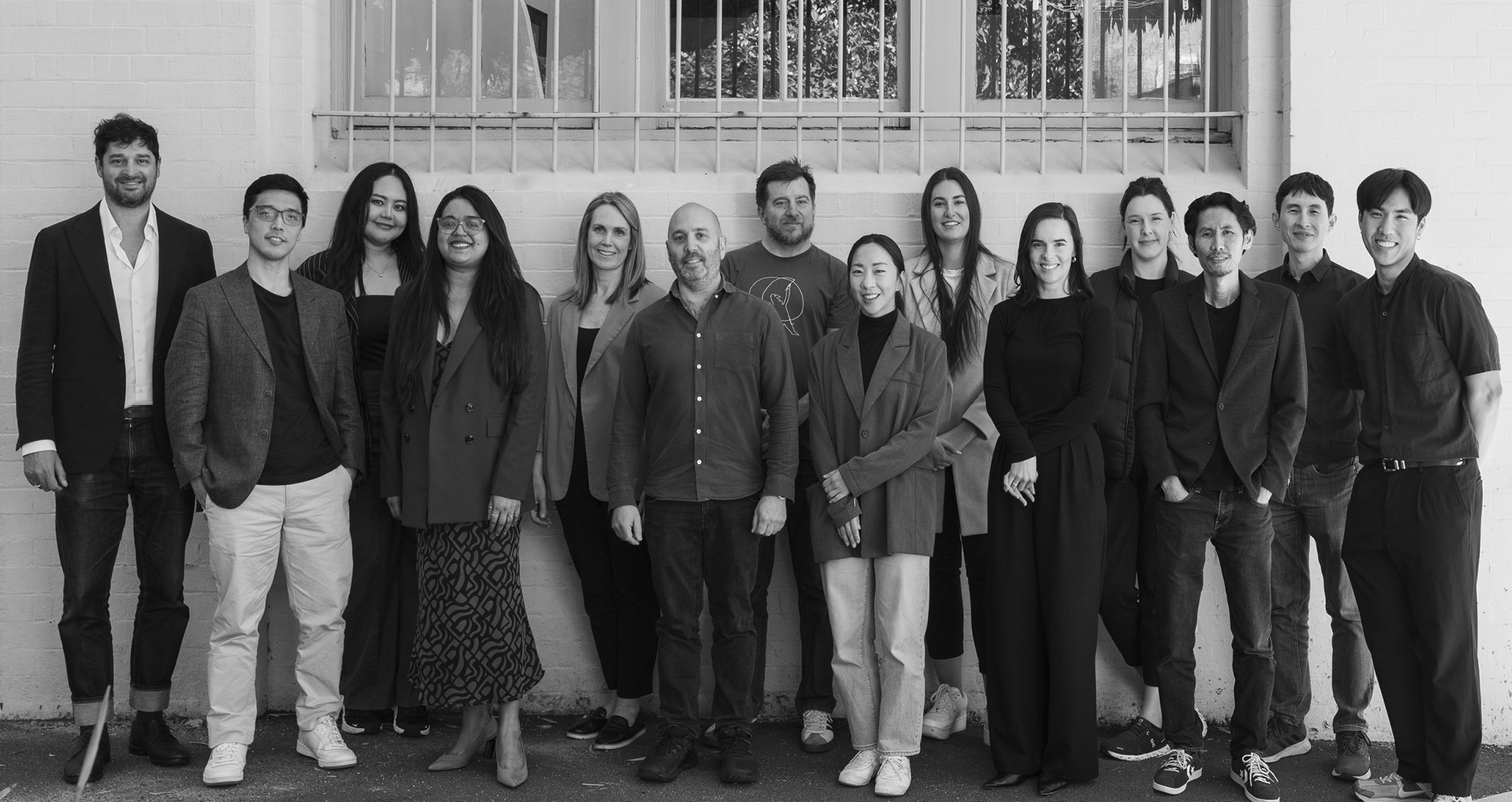 A black and white of all the team members of DACCA Group.