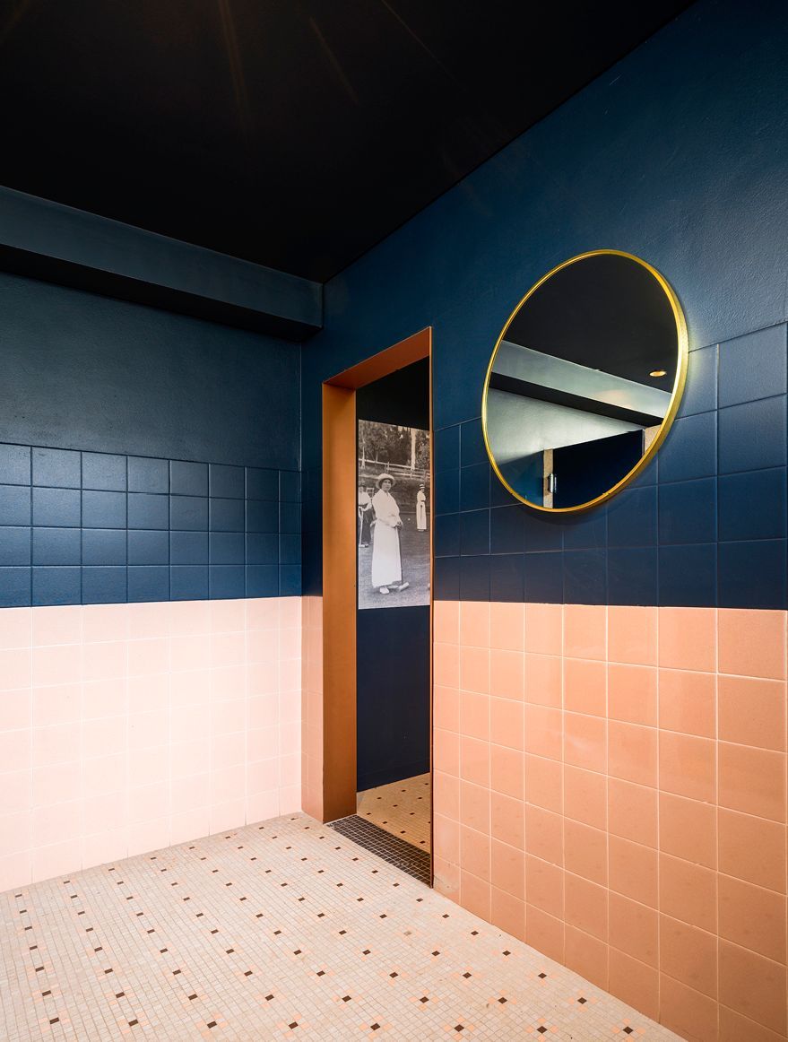 Revamped male and female amenities maintain original tiling