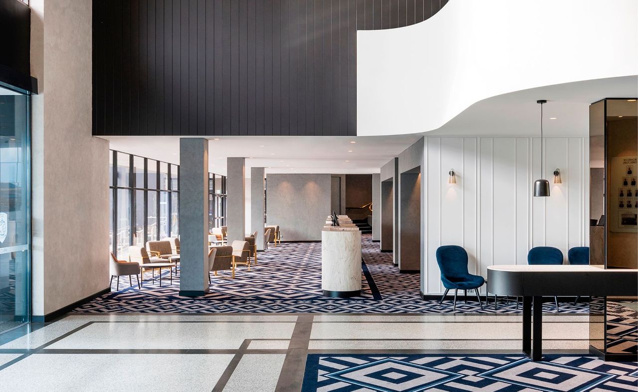 Completed foyer with reception check-in counters and waiting lounge