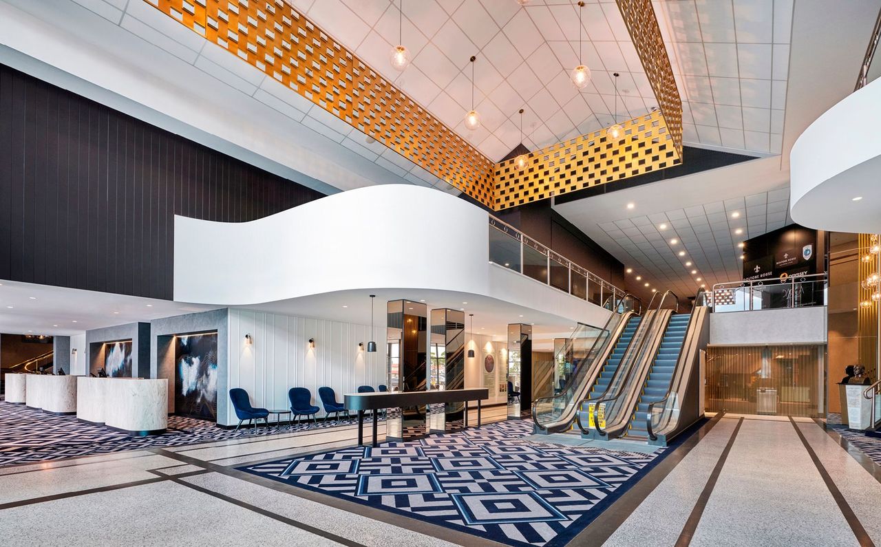 Completed foyer with access to club beyond the gold chain curtain. Escalators provide access to function rooms above