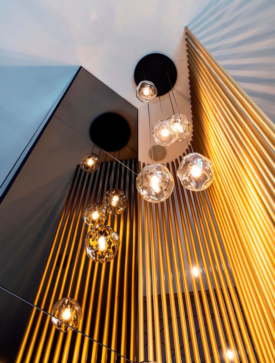 Double-height light feature connects foyer to function space above