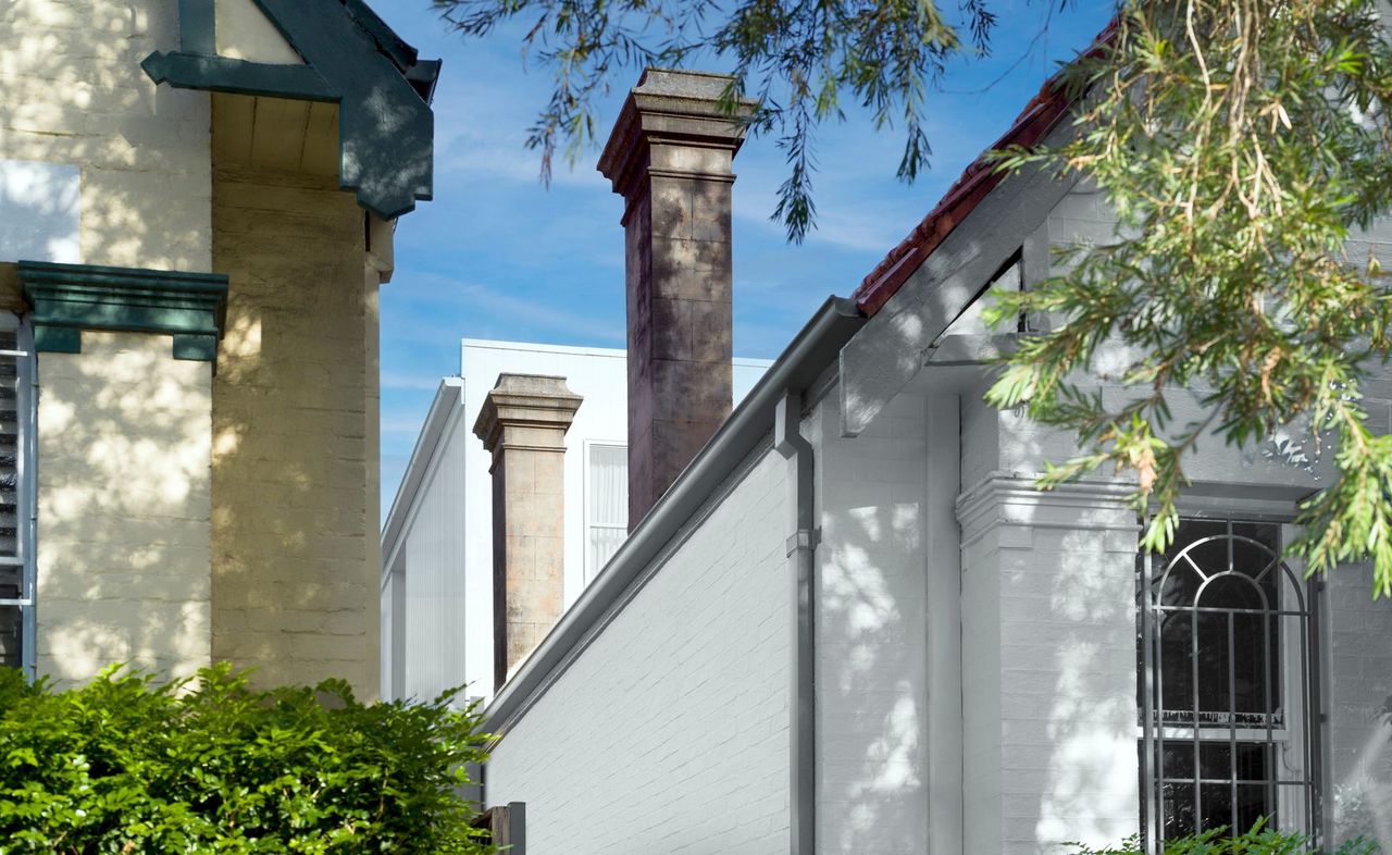 Sensitive extension to an inner city cottage concealing it from the street