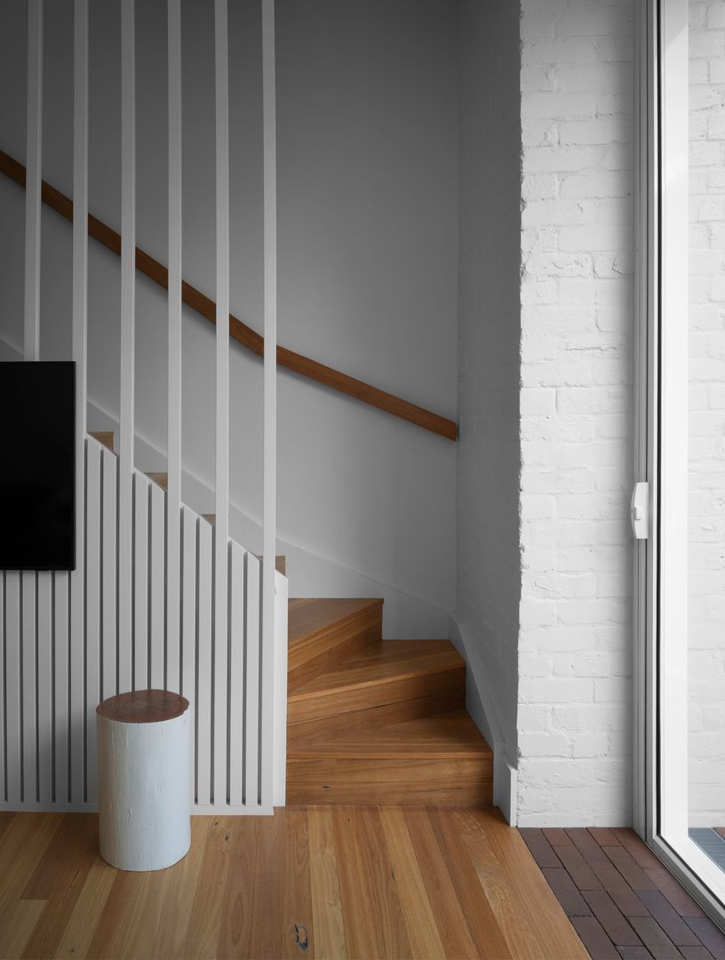Stairs with the living spaces of the modern extension