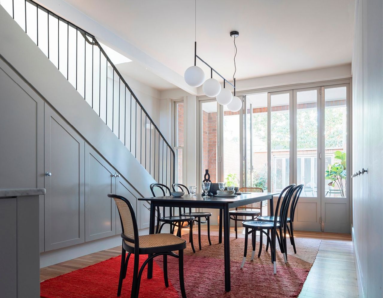Dining room out to rear courtyard and staircase to bedrooms
